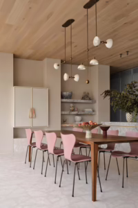 Luxury Melbourne interior featuring handcrafted Palladiana marble flooring, custom stone island bench, stone furniture and architectural feature wall by InStyle Stone.