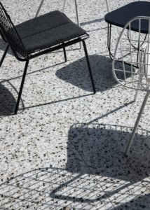 A beautiful outdoor patio with a terrazzo tile floor